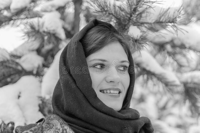 Russian Beautiful Girl Near The Christmas Tree In The Woods Lit By