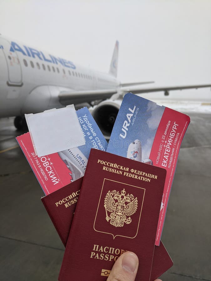 Russian Foreign Passport With A Plane Ticket. Ural Airlines On The