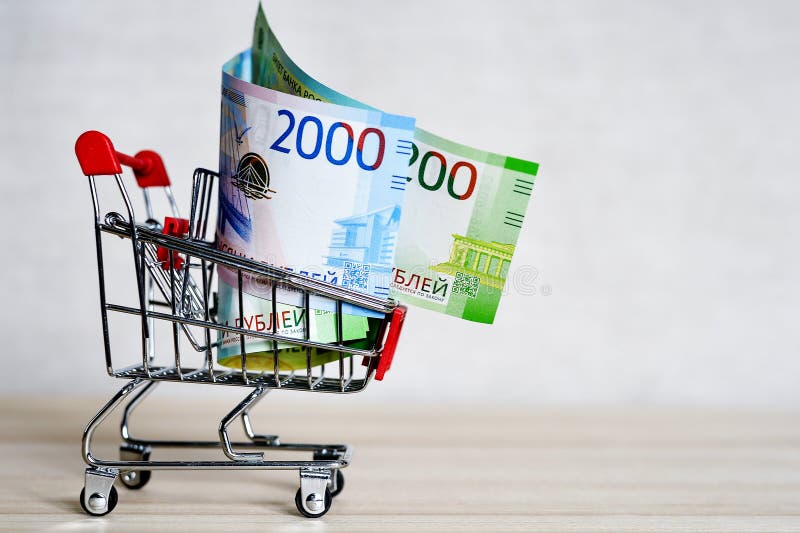 Russian money banknotes in a shopping trolley, online shopping concept stock photography Russian money banknotes in a shopping trolley, online shopping concept stock photography