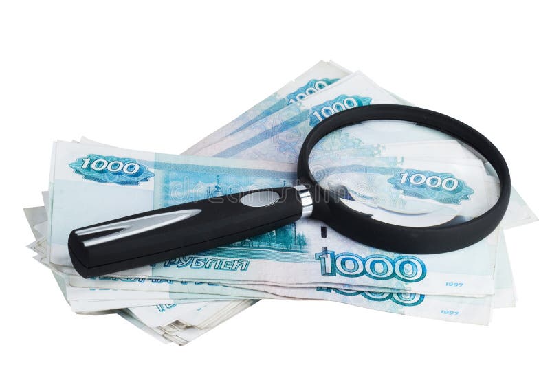 Russian money roubles and magnifying glass