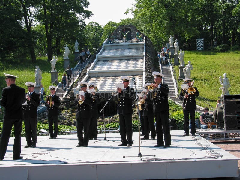 Russian naval orchestra performs for tourists at formal garden near fountain Cascade Chess Mountain royalty free stock photo Russian naval orchestra performs for tourists at formal garden near fountain Cascade Chess Mountain royalty free stock photo