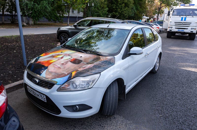 Russian vehicle Lada with portrait of Vladimir Putin on the hood royalty free stock images Russian vehicle Lada with portrait of Vladimir Putin on the hood royalty free stock images