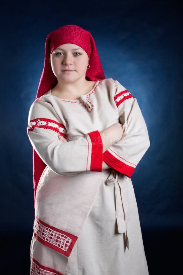 Russian woman posing in national clothes