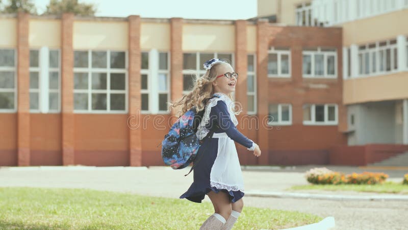 Russian 13 Year Old Schoolgirl in a Good Mood with a Backpack. Stock Footage - Video of call, background: 131658814