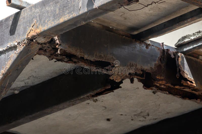 Rust on steel structural columns & post floor support