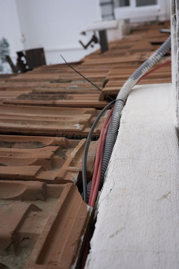 Rustic brown tile roof and sea view stock photography