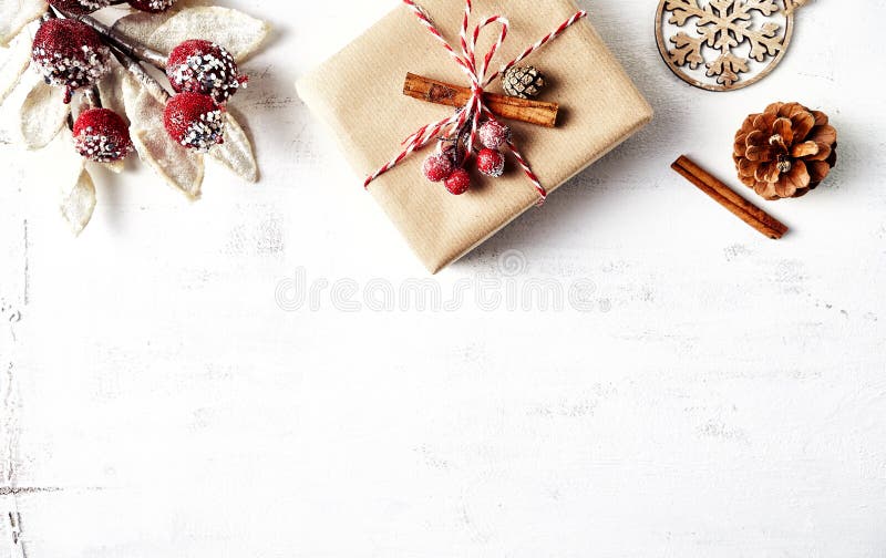 Rustic Christmas gift box with Christmas decorations on white wooden background. Flatlay. Copy space. Rustic Christmas template stock photography Rustic Christmas gift box with Christmas decorations on white wooden background. Flatlay. Copy space. Rustic Christmas template stock photography