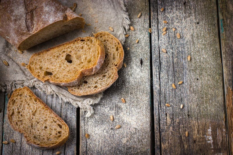 Rustic food background with fresh homemade whole wheat bread