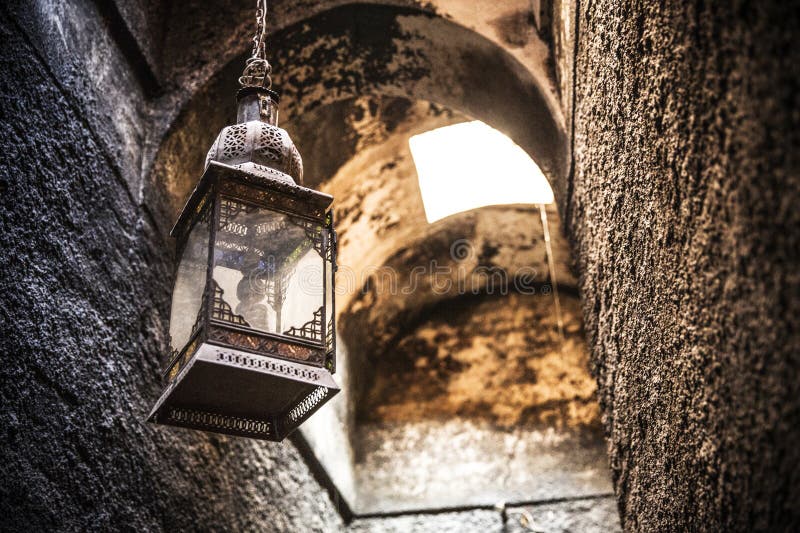 Rustic Lantern in the Shadows of Marrakesh’s Medina royalty free stock image
