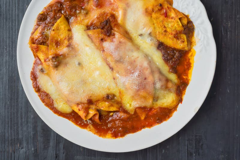 Rustic Messy Cheesy American Mexican Beef Enchiladas Stock Photo ...