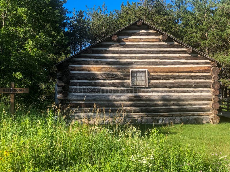 Old wooden schoolhouse in Wisconsin. These rustic old wooden log building once operated as a one-room schoolhouse in Wisconsin royalty free stock image Old wooden schoolhouse in Wisconsin. These rustic old wooden log building once operated as a one-room schoolhouse in Wisconsin royalty free stock image