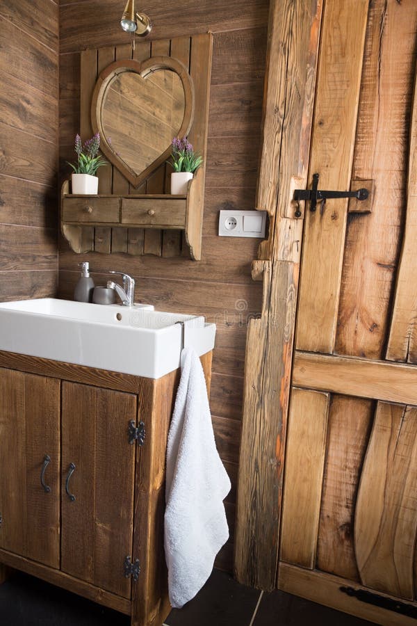 Rustic, rough style wooden board plank door, bathroom interior