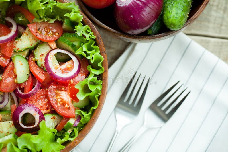 Rustic Salad Of Fresh Tomatoes Cucumbers Red Onions And Lettuce