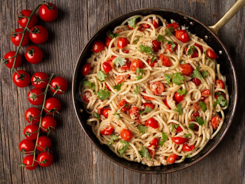 Rustic Spicy Italian Crab and Cherry Tomato Spaghetti Pasta Stock Photo