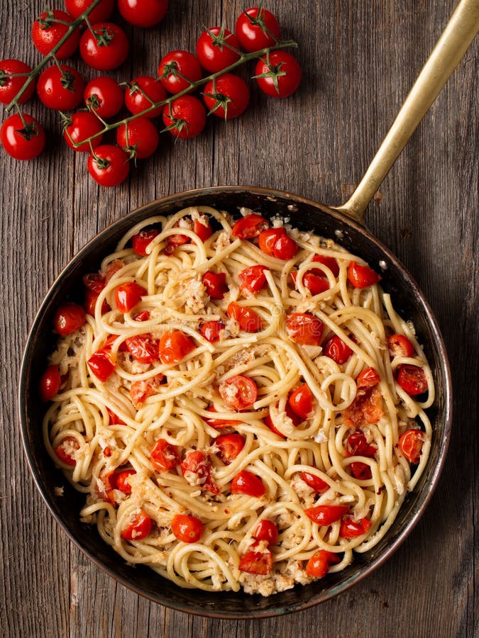 Rustic Spicy Italian Crab and Cherry Tomato Spaghetti Pasta Stock Image