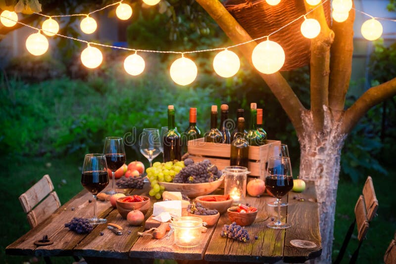 Aesthetic picnic outdoors with wine glasses bread berries and flowers.  Rustic picnic with neutral tones colours. Stock Photo by  ©lamapacas.gmail.com 378791178