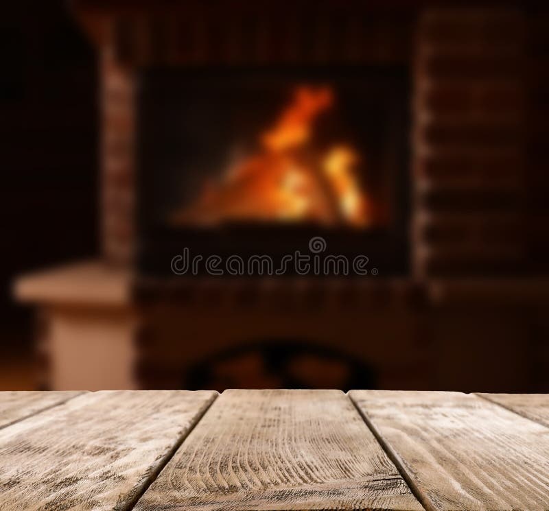 Rustic table and fireplace with burning wood