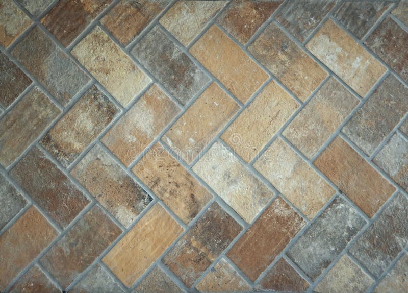 Rustic Floor Texture Made of Mixed Terracotta Bricks. Exterior Tiles