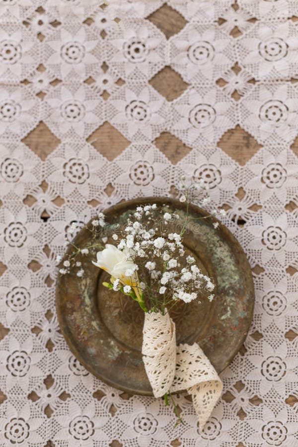 Rustic wedding concept. Small fresia and gypsophila flowers bouq. Rustic wedding concept. Top view shot of small fresia and gypsophila flowers bouquet in vintage royalty free stock images Rustic wedding concept. Small fresia and gypsophila flowers bouq. Rustic wedding concept. Top view shot of small fresia and gypsophila flowers bouquet in vintage royalty free stock images