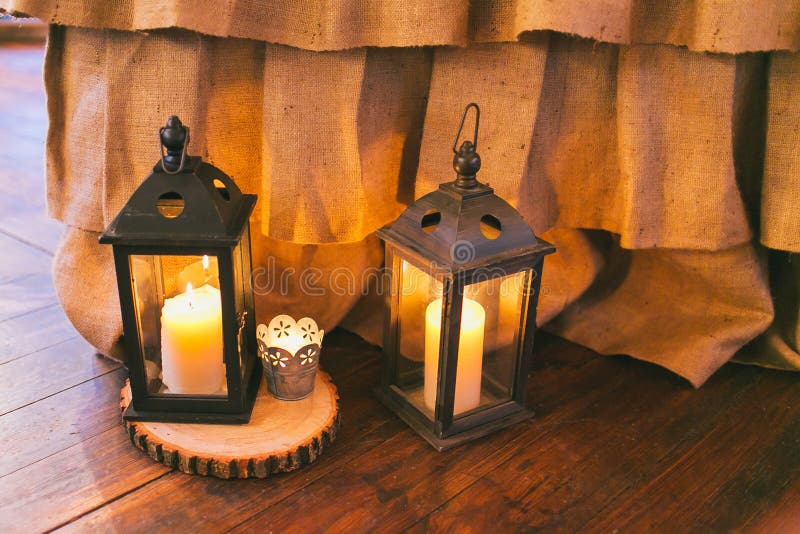 Rustic Wedding Decor, Black Lanterns with Candles on the Floor Stock