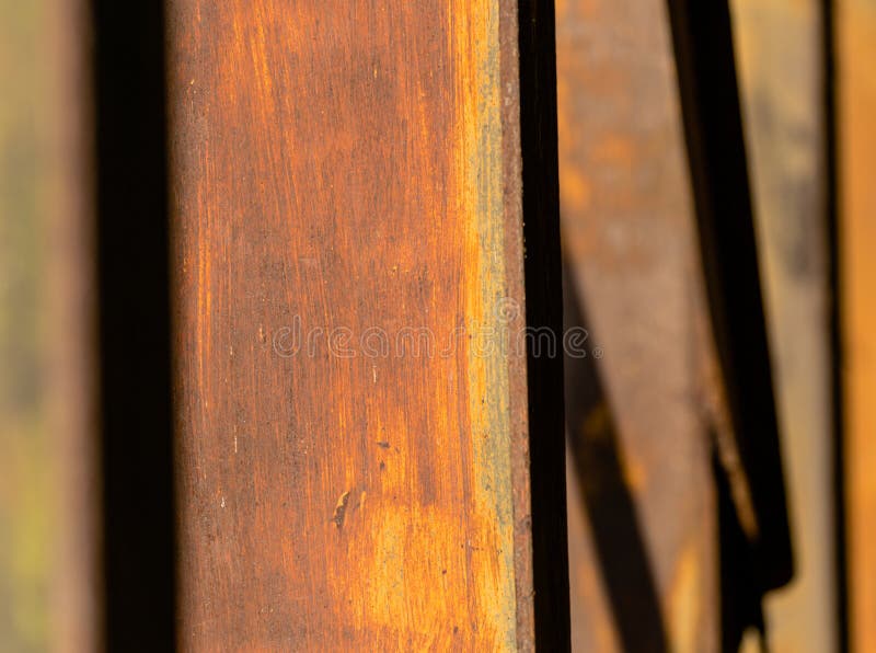 Rusting vertical metal lines