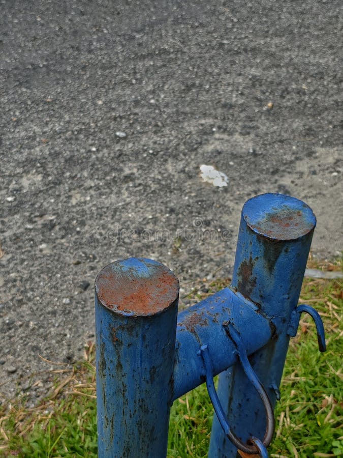 Rusty Blue Metal Posts with Weathered Industrial Texture royalty free stock image