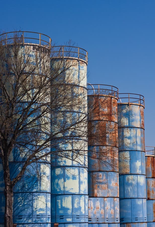 Rusty Blue Tanks on a Blue Sky