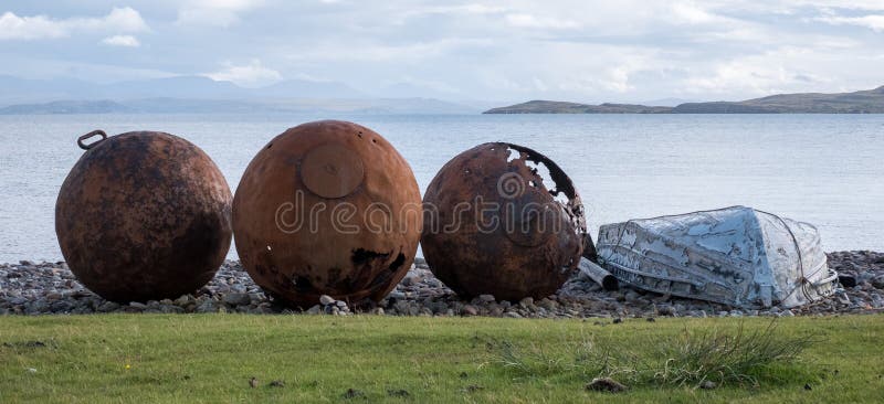 Rusty buoys on the beach at Polbain, north of Ullapool, on the west coast of Scotland.