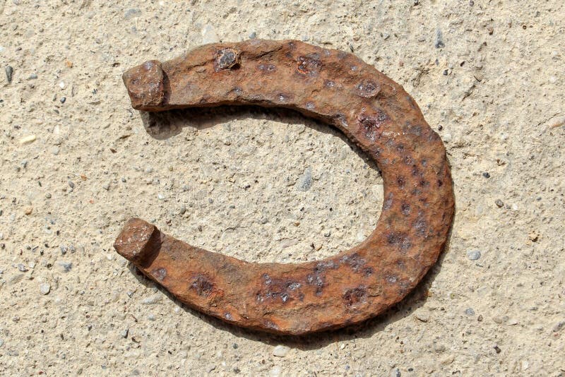 Horseshoe On Concrete Floor Stock Image - Image of brown, farm: 108359393