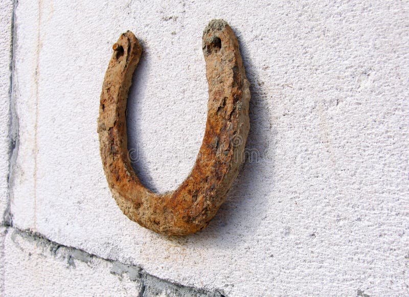 An Old Horseshoe on a Red Wall Stock Photo Image of antique, cowboy