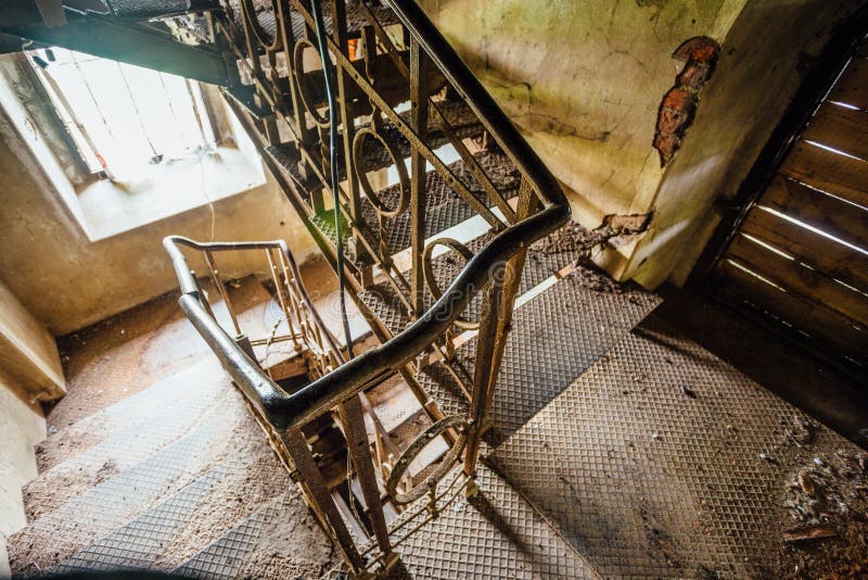 Rusty iron stairs in the old abandoned mansion stock image Rusty iron stairs in the old abandoned mansion stock image