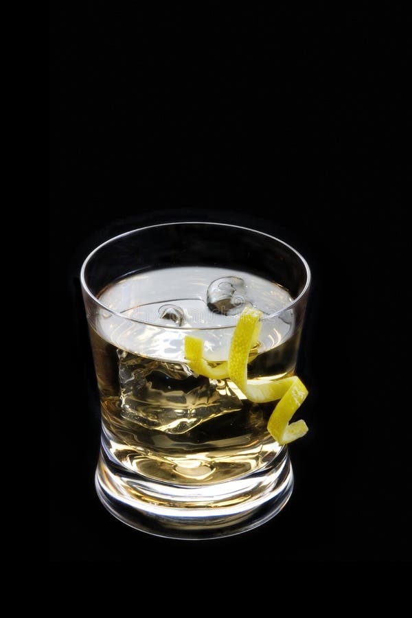 Rusty nail with lemon peel on a black background royalty free stock photography Rusty nail with lemon peel on a black background royalty free stock photography