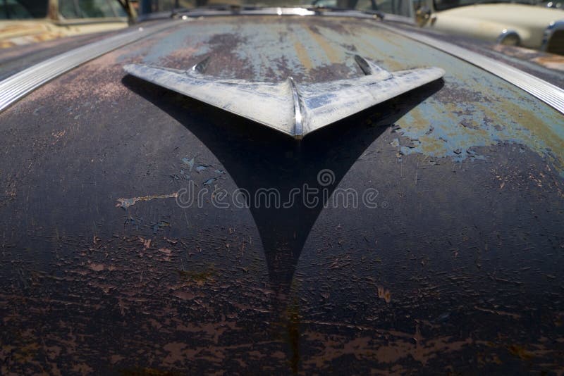 Rusty old hood ornament vintage farm truck fender