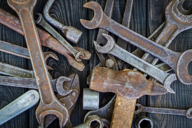 Rusty Old Tools On Black Vintage Wood Background Stock Image - Image of ...