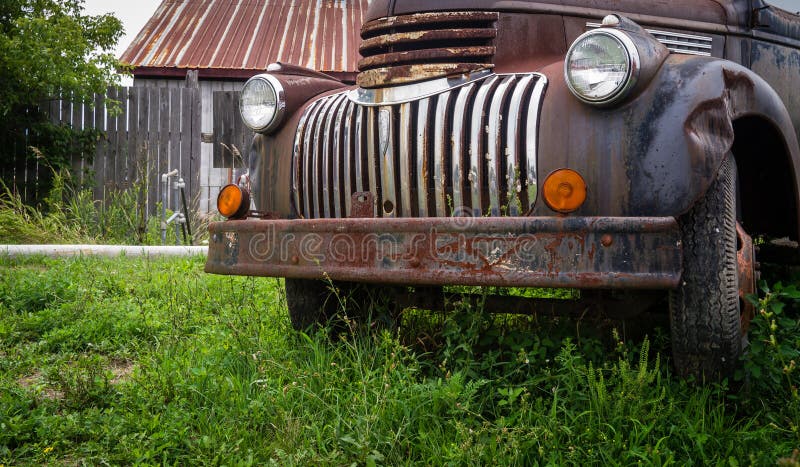 Rusty old truck in farm field