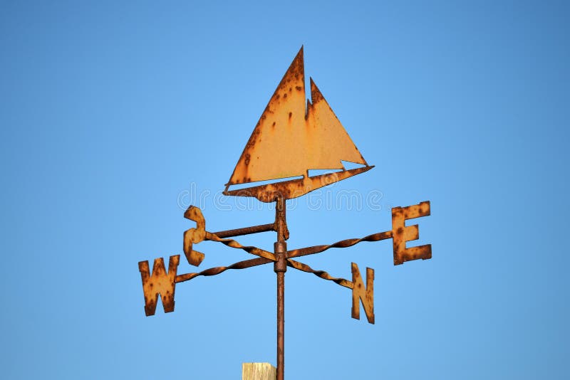 Rusty orange yacht weather vane