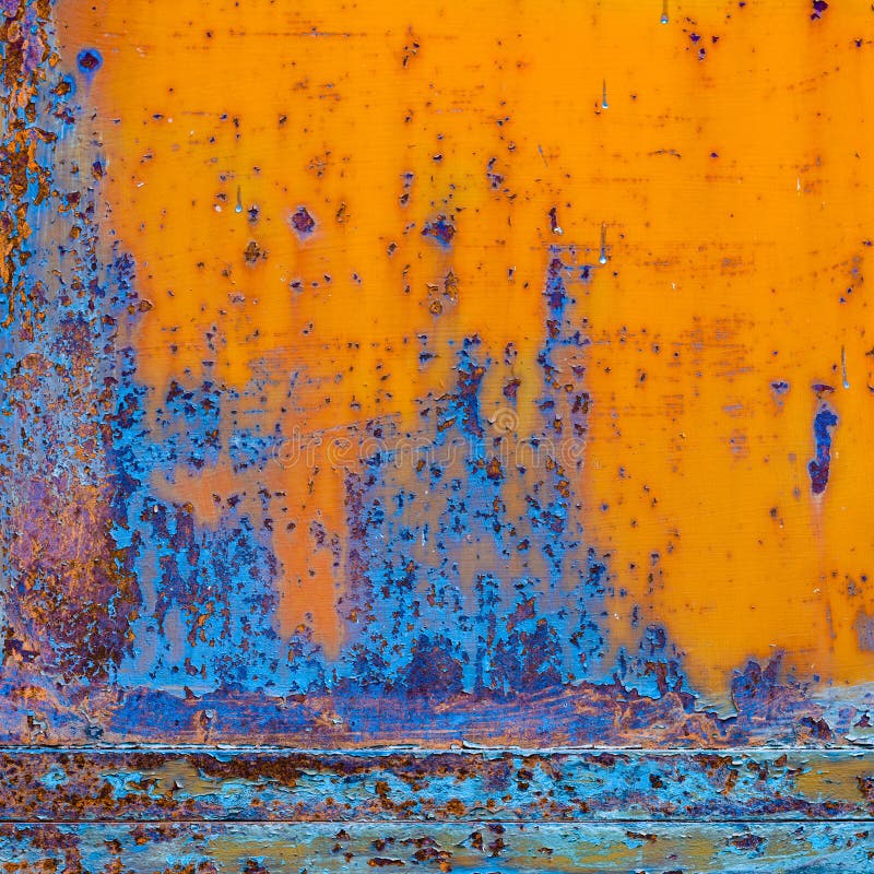 Rusty painted metal with cracked paint. Orange and blue colors. stock photography