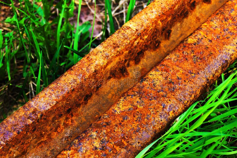 Rusty rail. Corrosion of metal on an old, abandoned road. Close-up