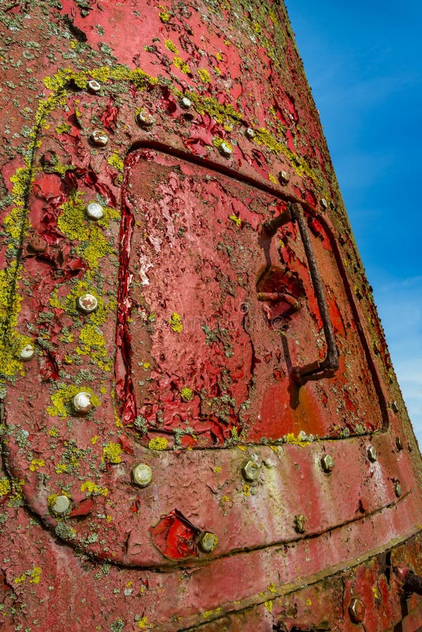 Rusty red marker buoy with steel hatch stock photos