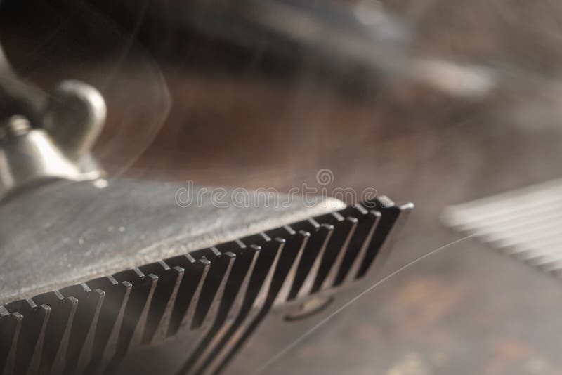 On a Rusty Surface are Old Barber Tools. Vintage Manual Hair Clipper