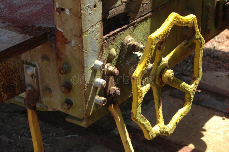 Rusty yellow wheel on valve royalty free stock images