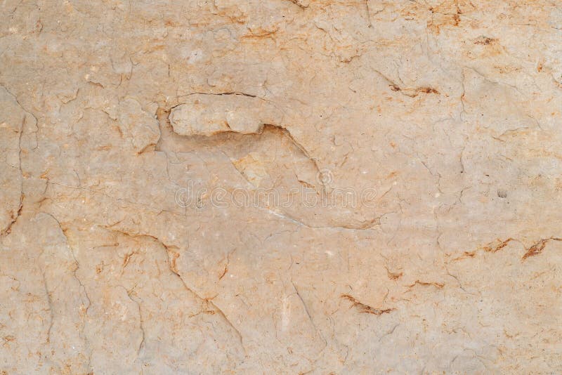 Ruw de textuur van de rotssteen geeloranje natuurlijk zandsteen als achtergrond stock afbeelding Ruw de textuur van de rotssteen geeloranje natuurlijk zandsteen als achtergrond stock afbeelding