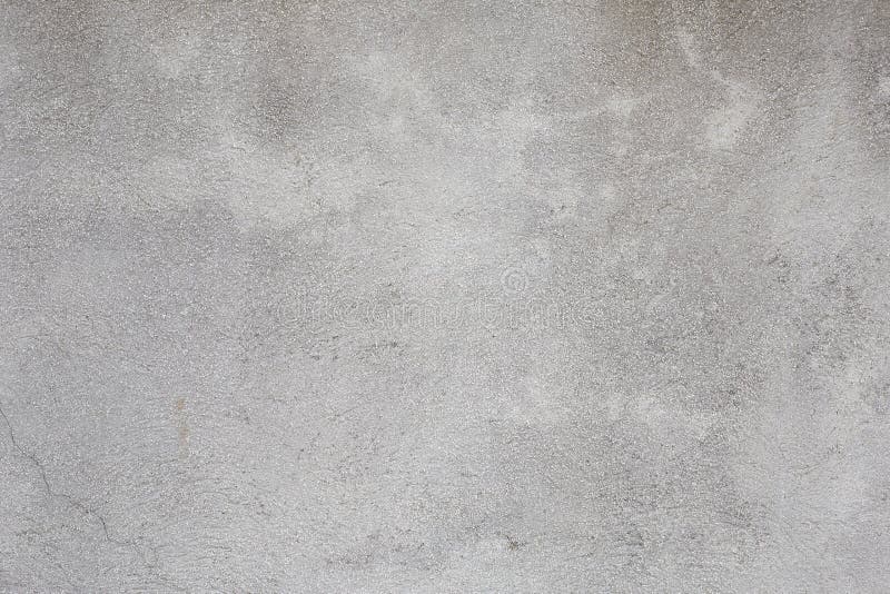 Ruwe grijze de textuurachtergrond van de cementmuur