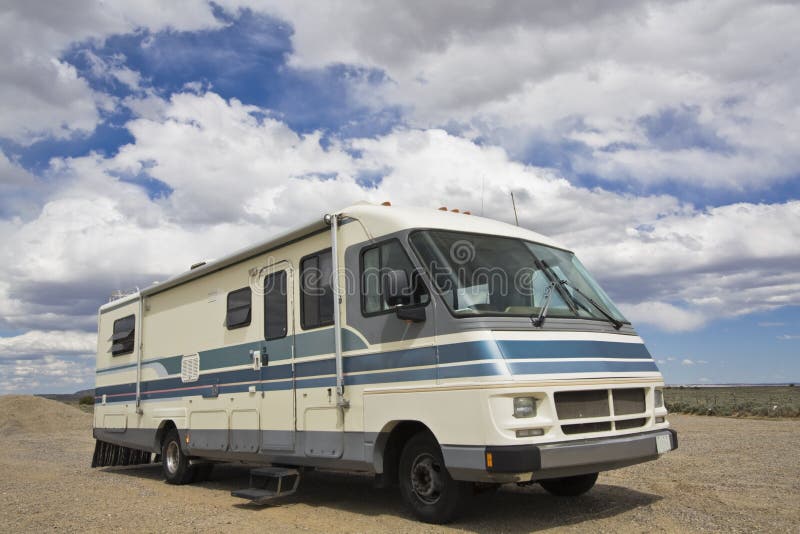RV against amazing clouds