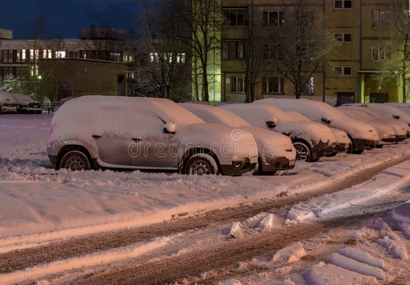 Rybatskoe, St. Petersburg. Russia. December 2, 2019. City streets and park after heavy snowfall at night. Rybatskoe, St. Petersburg. Russia. December 2, 2019. City streets and park after heavy snowfall at night.