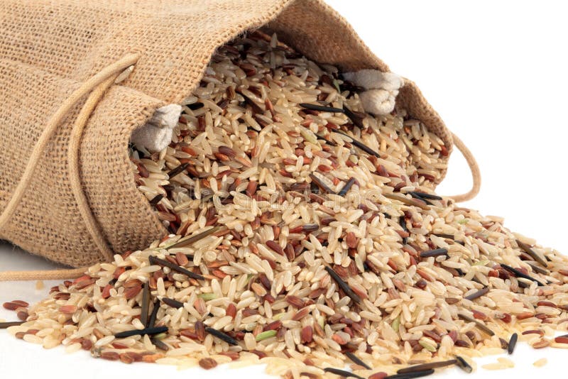Wild rice in a hessian sack and loose over white background. Wild rice in a hessian sack and loose over white background.