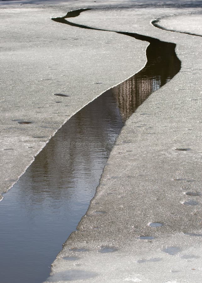 Spring ice-hole on the river. Abstract background. Spring ice-hole on the river. Abstract background.