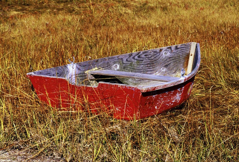 Old row boat in marsh grass. Autumn, Cape Cod, MA. Old row boat in marsh grass. Autumn, Cape Cod, MA