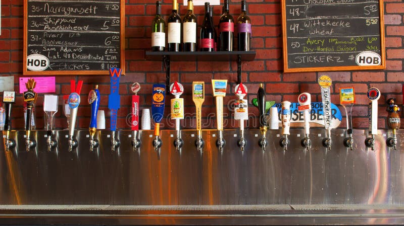 Row of beer taps from craft beers of the world. Row of beer taps from craft beers of the world