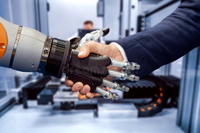 Ręka biznesmena chwiania ręki z androidu robotem zdjęcia royalty free Ręka biznesmena chwiania ręki z androidu robotem zdjęcia royalty free